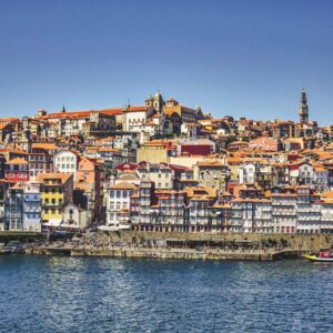 city buildings near body of water during daytime